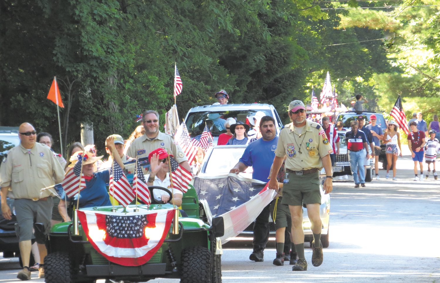 Started 27 years ago, the Warwick Neck Fourth of July parade has become a neighborhood classic that brings out the red, white and blue and lots of decorated vehicles – even lawn mowers. Susan Dzyacky, who has done so much for the Neck over the years, was this year’s Grand Marshal.  More photos are featured on page 6. (Warwick Beacon photos by Kathy Eisemann)